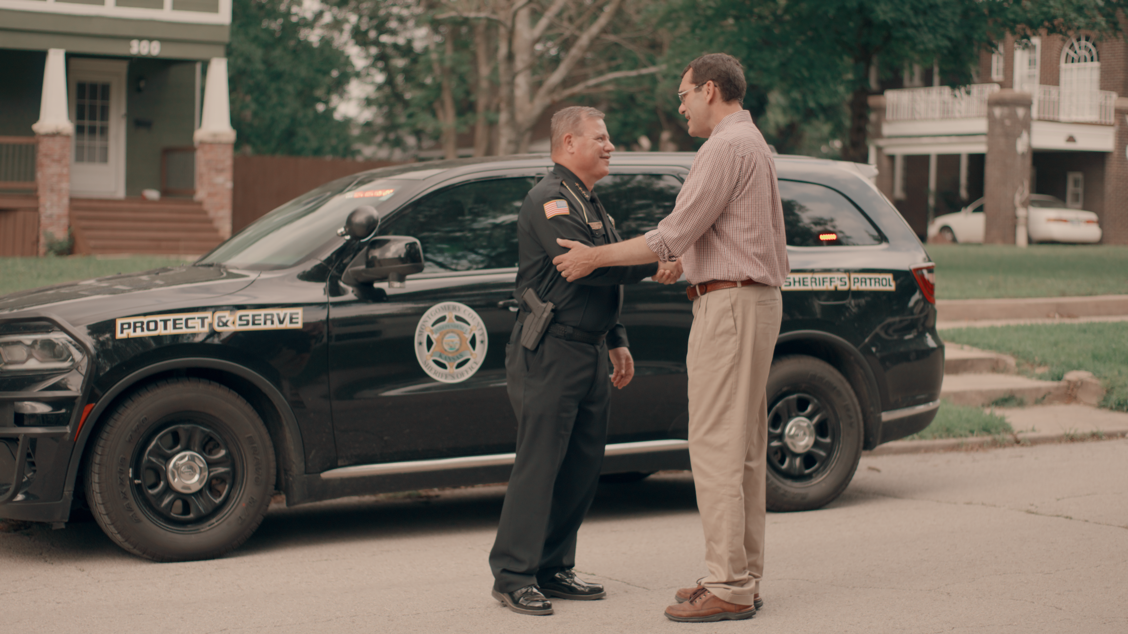 Derek Schmidt talking to a police officer